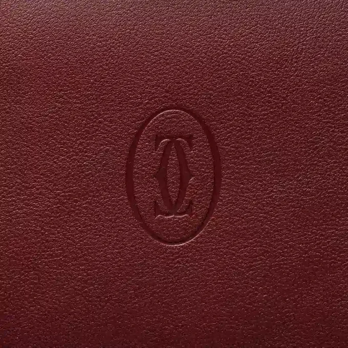 Internationale Geldbörse mit Seitenfalten, Must de Cartier – burgunderrotes Kalbsleder, goldfarbenes Finish – Cartier