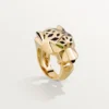 Panthere De Cartier Ring – Gelbgold, Lack, Tsavorit-Granat, Onyx – Cartier